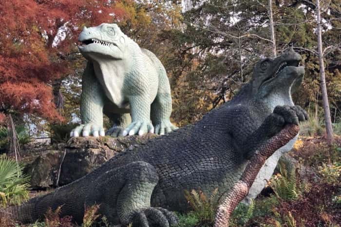 Benjamin Waterhouse Hawkins and Sir Richard Owen hold a dinner party inside a life-sized model of Iguanodon